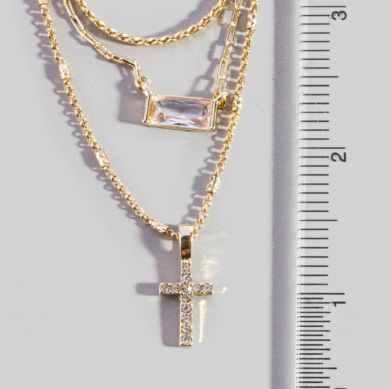 Triple layered chain pave cross pendant necklace
